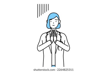 A woman doctor in white coat apologizing with her hands in front of her body.