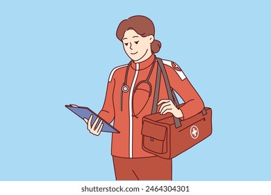 Woman doctor working in ambulance and 911 service is wearing red uniform and holding clipboard. Ambulance girl arrived at scene of incident to save life of patient who was in trouble or had fracture.