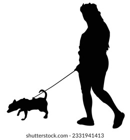 Woman with dog in silhouette