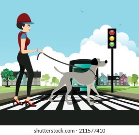 Woman and dog walking across the crosswalk