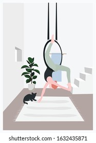 A woman doing aerial yoga on a ring - a concept illustration of healthy life, exercise