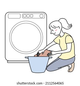 Woman Doing Laundry. Happy Young Woman Washing Clothes. Housewife Doing Laundry At Home. Young Lady Loading Clothes Into The Washer. Smiling Woman Putting Laundry In Basket In Front Of Washer.