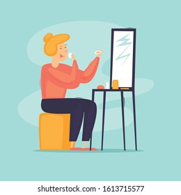 Woman is doing makeup. Flat design vector illustration.