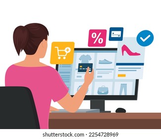 Woman doing online shopping, she is purchasing products and paying with a credit card