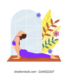 A woman doing yoga exercises, with Cobra pose.