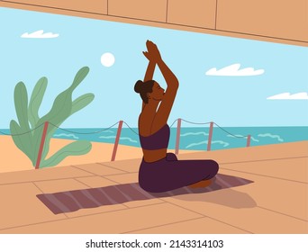 Woman doing yoga and meditating in lotus position on the beach. 