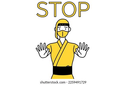 A woman dressed up as a ninja with her hand out in front of her body, signaling a stop.