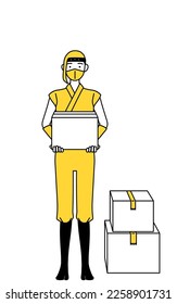 A woman dressed up as a ninja working to carry cardboard boxes