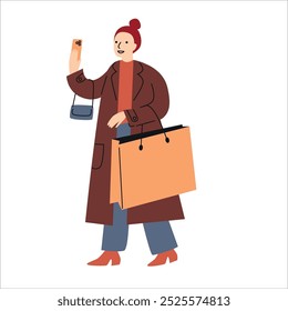 Woman dressed in trench coat holding shopping bags. Shopping with a smartphone. Winter and Christmas sale. 