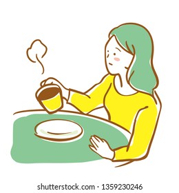 Woman drinking coffee in a cafe