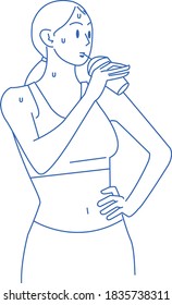 Woman drinking a drink after exercise