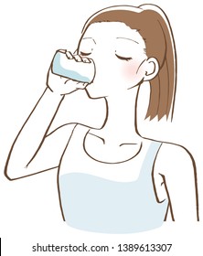 A woman drinking water in a cup