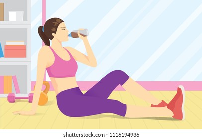 Woman drinking whey protein from bottle at gym
