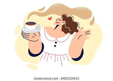 Woman drinks coffee and enjoys aroma of invigorating hot drink, enjoying happy morning. Young girl in white dress holding cup of delicious espresso coffee for breakfast or work break