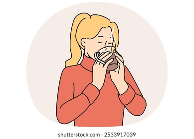 Woman drinks hot tea to keep warm and quench thirst after walk in park in cold winter weather. Girl in sweater holds mug of tea and enjoys taste and aroma of drink made from natural herbs