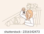 Woman driver with key to donated car sits behind wheel and brags about buying or getting loan on favorable terms. Girl in gift car with giant bow rejoices at successful purchase in dealership