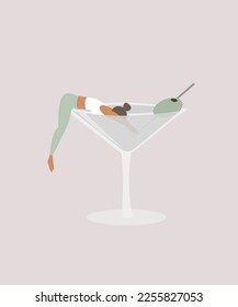 Woman drowning in a martini cocktail glass. Alcoholism concept