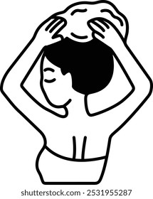 A woman is drying her hair with a towel