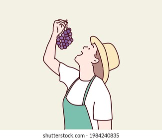 mujer comiendo uvas. Ilustraciones de diseño vectorial de estilo dibujado a mano.