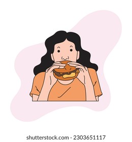 a woman is eating a large burger