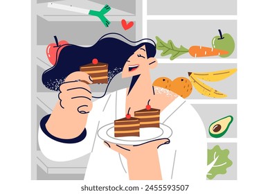 Woman eats dessert, breaking diet due to lack of willpower, and stands near refrigerator with fruits and vegetables. Girl uses cheat meal tactics during diet, eating cake after long break.