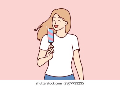 Woman eats ice cream to cool off in hot summer weather and enjoy cold sweet dessert. Young girl in casual clothes holds ice cream and smiles enjoying treat that relieves thirst and hunger.