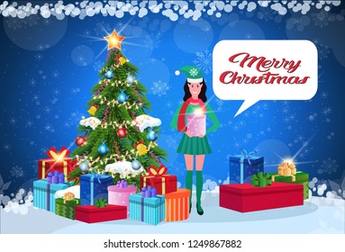 woman elf costume holding gift box standing near fir tree happy new year merry christmas concept chat bubble flat horizontal banner inscription