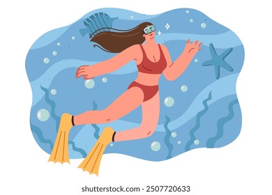 Woman is engaged in diving, swimming underwater among fish and sea plants, dressed in swimsuit and eye mask. Girl gets into diving during vacation and trip to resort with stunning wildlife.