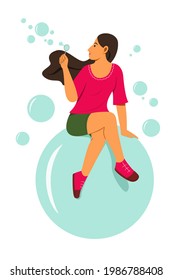 Woman is Enjoy Blowing Bubbles While Sitting on the Big Bubble for the Concept of Summer Lifestyle.
