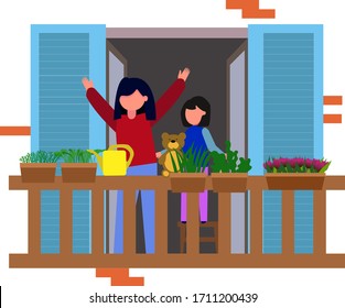 A woman enjoys the clean air and the view from the balcony with her hands up. Mother stands with her daughter on the balcony