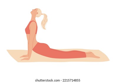 Woman exercises at home, stretches out, curves her back lying on the floor