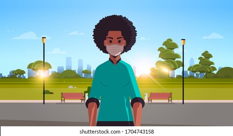 woman in face protective mask against corona virus covid-19 protection stop coronavirus pandemic concept african american girl walking outdoor cityscape background horizontal portrait vector