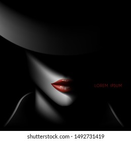 Woman face in shadow with red lips