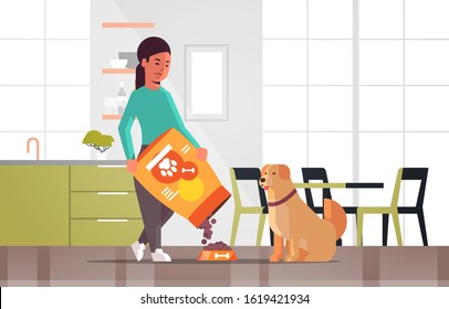 woman feeding hungry labrador retriever girl giving her dog dry food granules domestic life with pet concept modern kitchen interior horizontal full length vector illustration