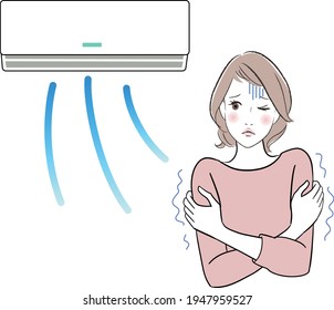 A woman feels cold as the air conditioner is too strong