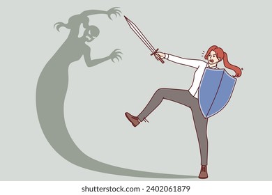 Woman fights with own shadow, holding shield and sword for concept overcomes internal fears and barriers. Brave girl overcomes fear and gets rid of phobia that interferes with personal growth