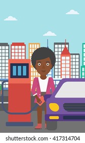 Woman filling up fuel into car.