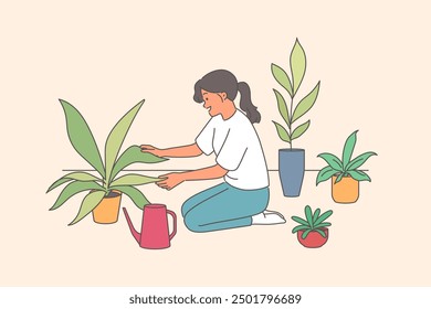 Woman florist takes care of house plants and carefully holds on to petals kneeling near watering can. Happy girl works as florist in flower shop specializing in selling indoor flowers