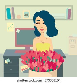 Woman with flowers in the office