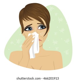 Woman with flu or allergy sneezing into her handkerchief