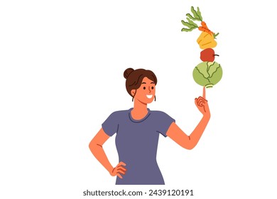 Woman follows balanced diet of vegetables and fruits leads healthy lifestyle thanks to proper nutrition. Vegetarian girl recommends new diet to detoxify body and lose excess weight.