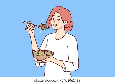 Woman follows diet by eating green seaweed salad to get rid of diseases and lead healthy lifestyle. Happy girl enjoying organic vegetable food following diet as recommended by nutritionist