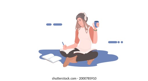 woman freelancer drinking coffee listening music writing report during coronavirus pandemic quarantine