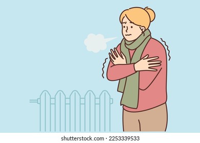 A woman freezes and stands in a room with a cold battery. It's cold outside the window. A woman wrapped in a sweater and scarf hugs herself. The concept of crisis and economy. Vector illustration.