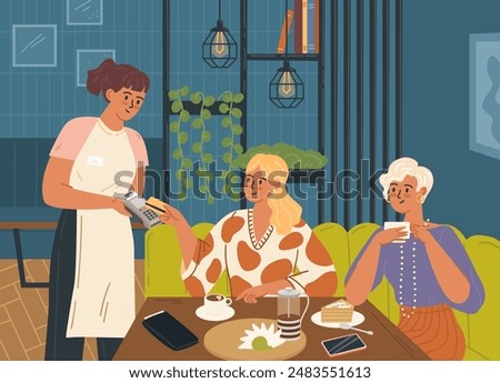 Woman friends paying for lunch in restaurant using credit card