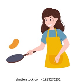 Woman fries pancakes in frying pan. Flips pancake in the air.