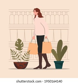 A woman in front of shop brings some bags of groceries illustration template premium vector