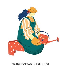 Woman Gardening in Overalls With Watering Can