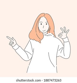 Woman gesturing hand pointing or showing to something for present, adverting concept.