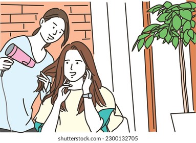 A woman getting her hair dried with a hairdryer